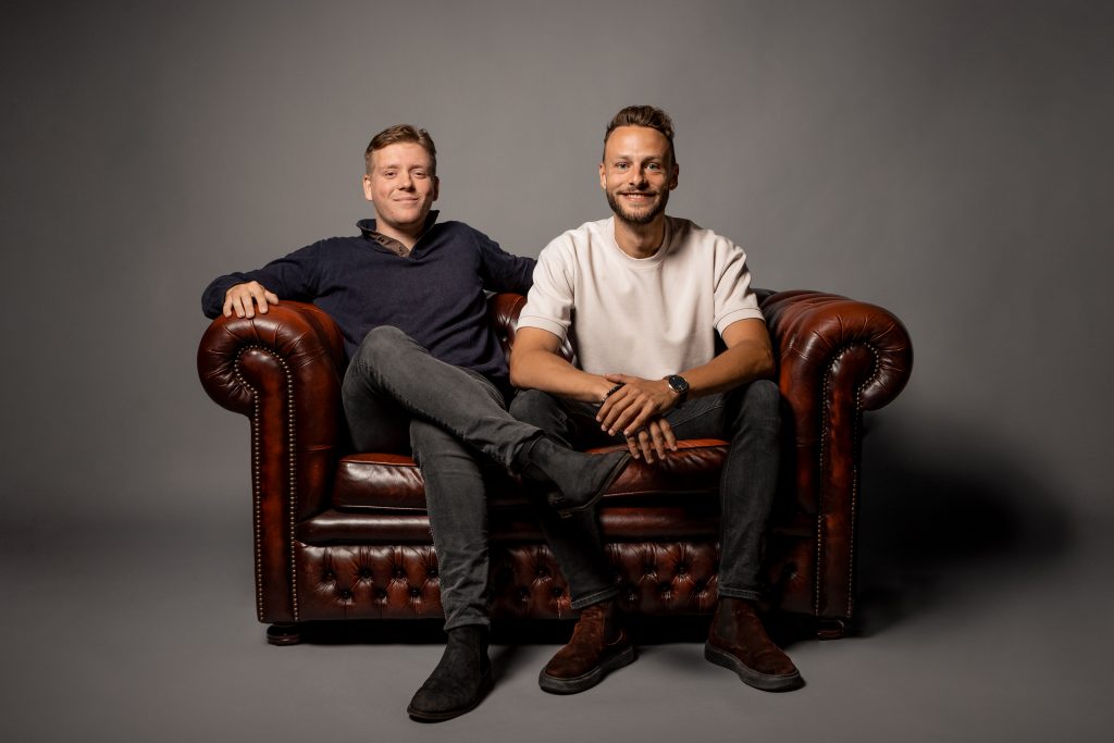 Founding duo of Grow-ID on a sofa, fundraising from angels